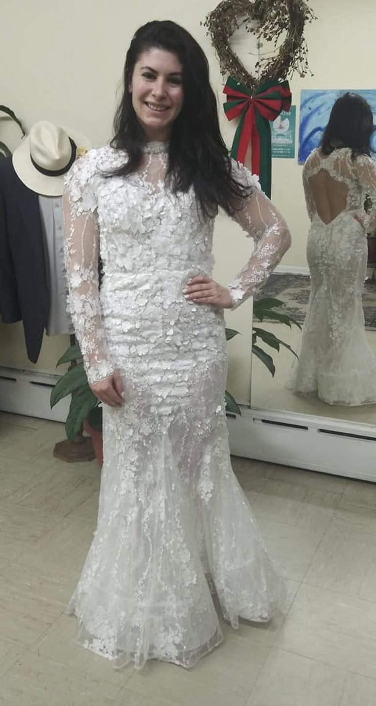 Bride in a lace mermaid gown after a fitting at Victor's